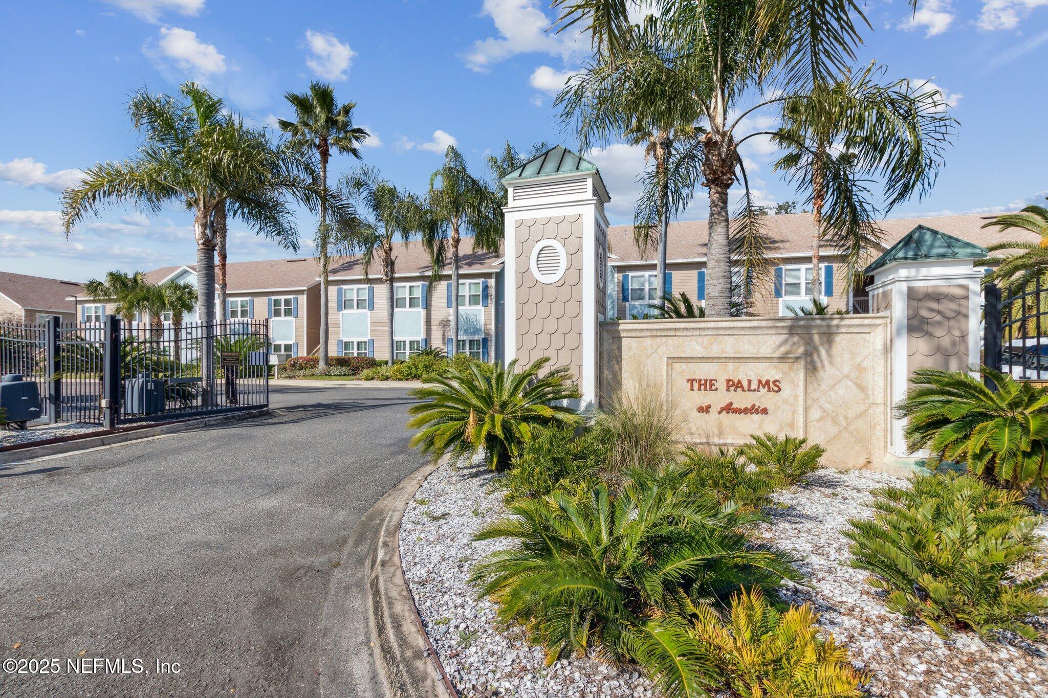 1601 Nectarine Street, Unit F6 Fernandina Beach, FL 32034 - Photo 30 of 57 a view of multiple house with a yard and palm trees