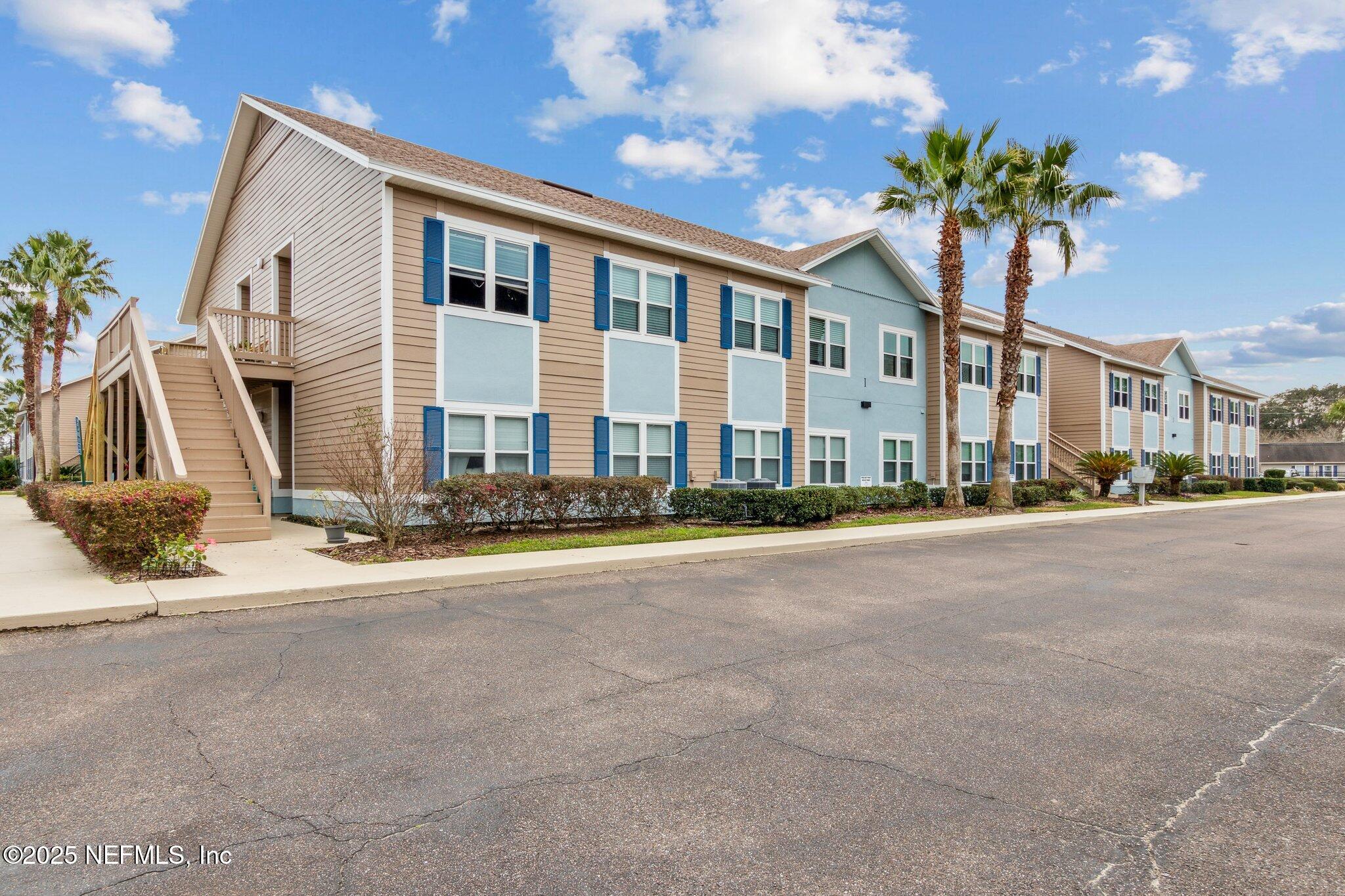 1601 Nectarine Street, Unit F6 Fernandina Beach, FL 32034 - Photo 36 of 57 a front view of a house with a garden