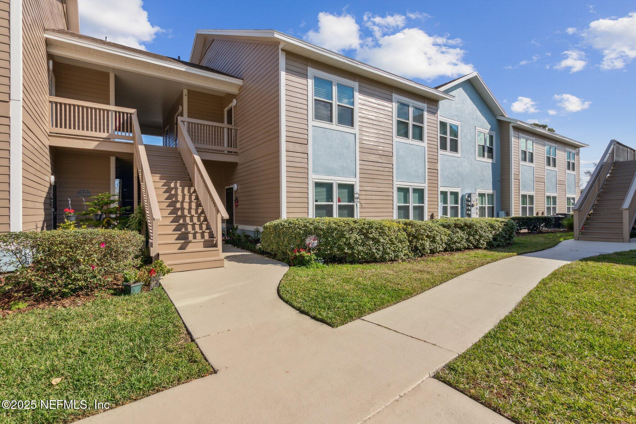 1601 Nectarine Street, Unit F6 Fernandina Beach, FL 32034 - Photo 40 of 57 a front view of a house with a yard