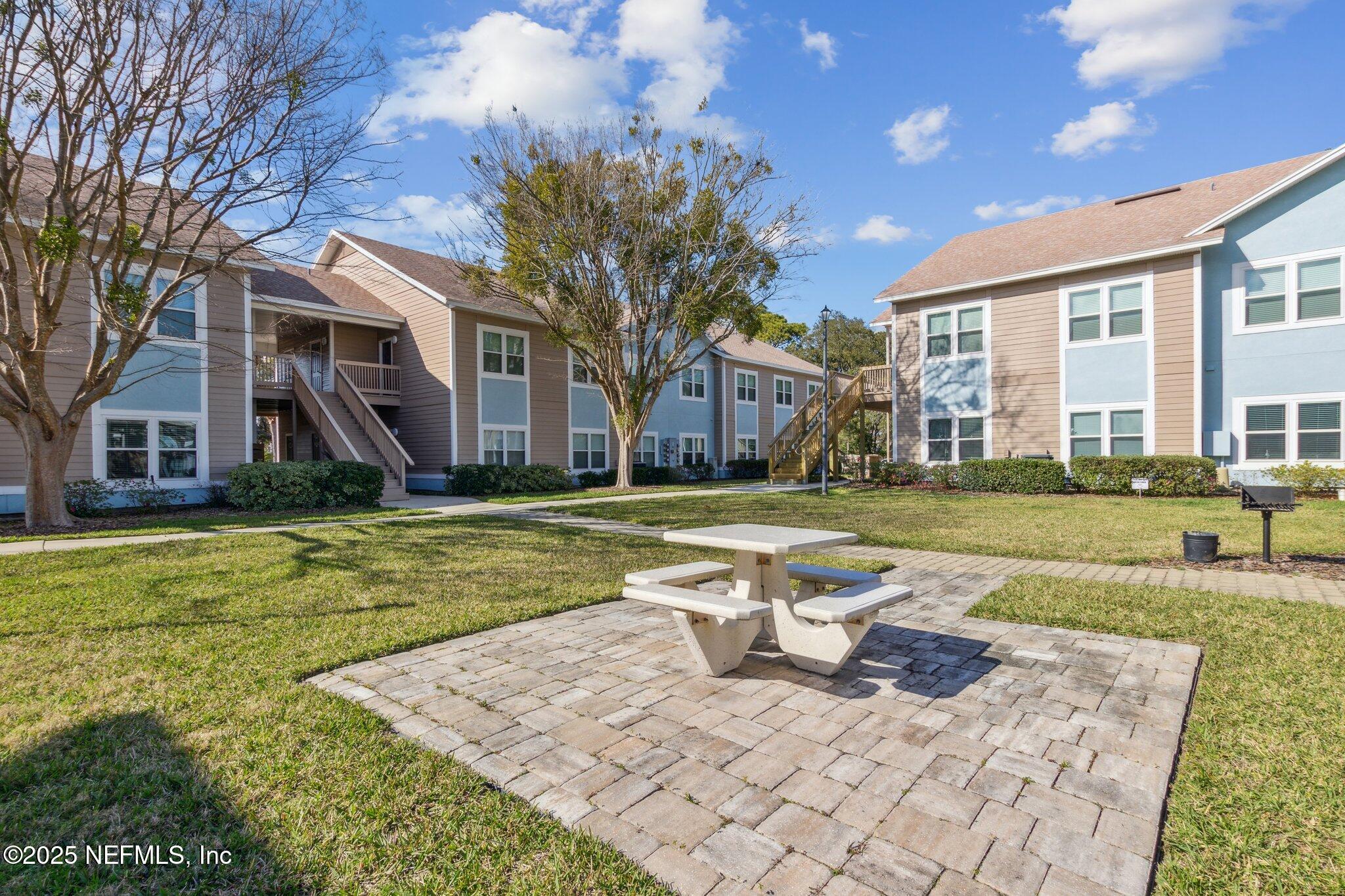 1601 Nectarine Street, Unit F6 Fernandina Beach, FL 32034 - Photo 46 of 57 a view of a house with swimming pool and yard