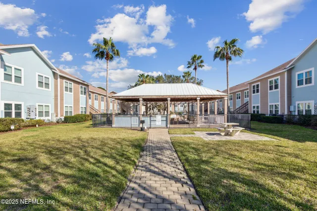 a view of multiple houses with a street