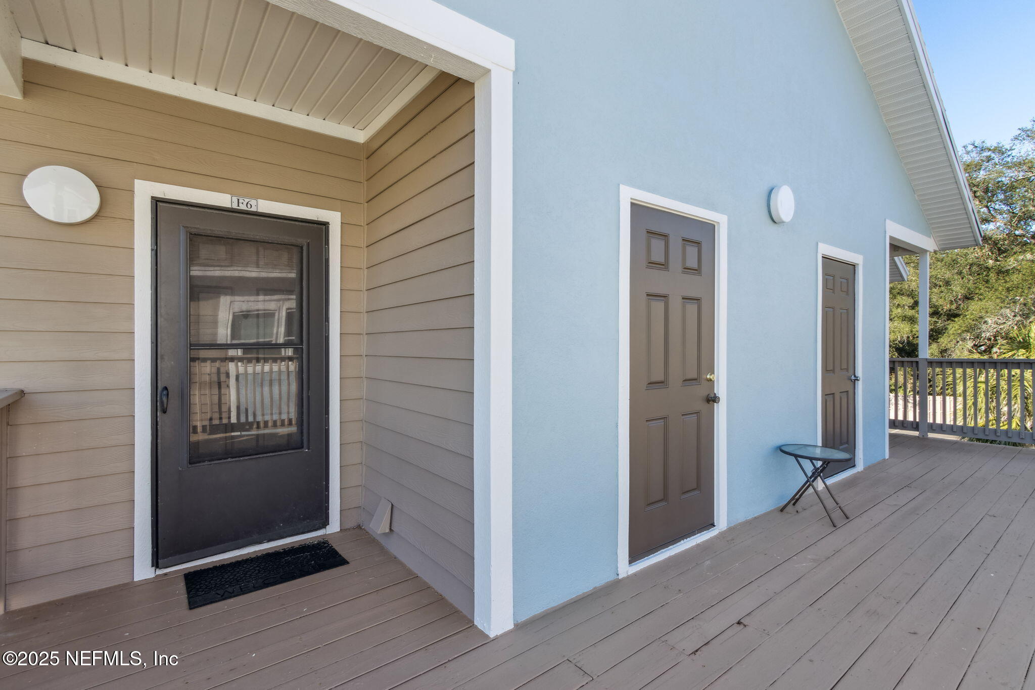 1601 Nectarine Street, Unit F6 Fernandina Beach, FL 32034 - Photo 6 of 57 a view of a hallway with wooden floor and closet
