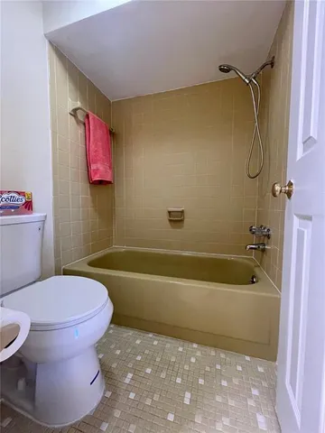 a bathroom with a tub and sink