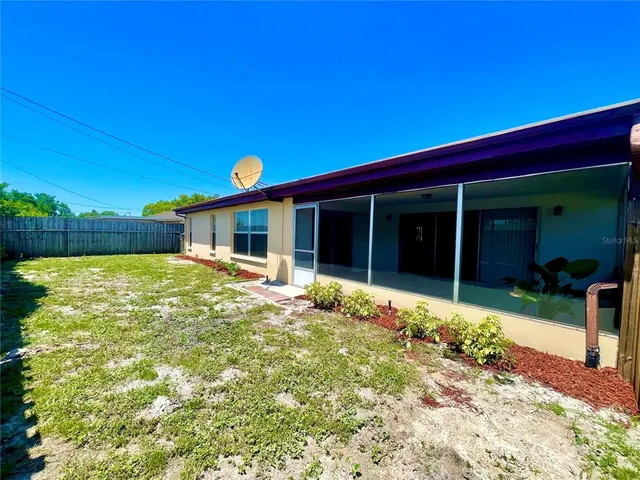 a backyard of a house with trees