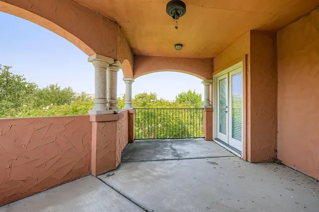 a view of a room with a big yard and potted plants