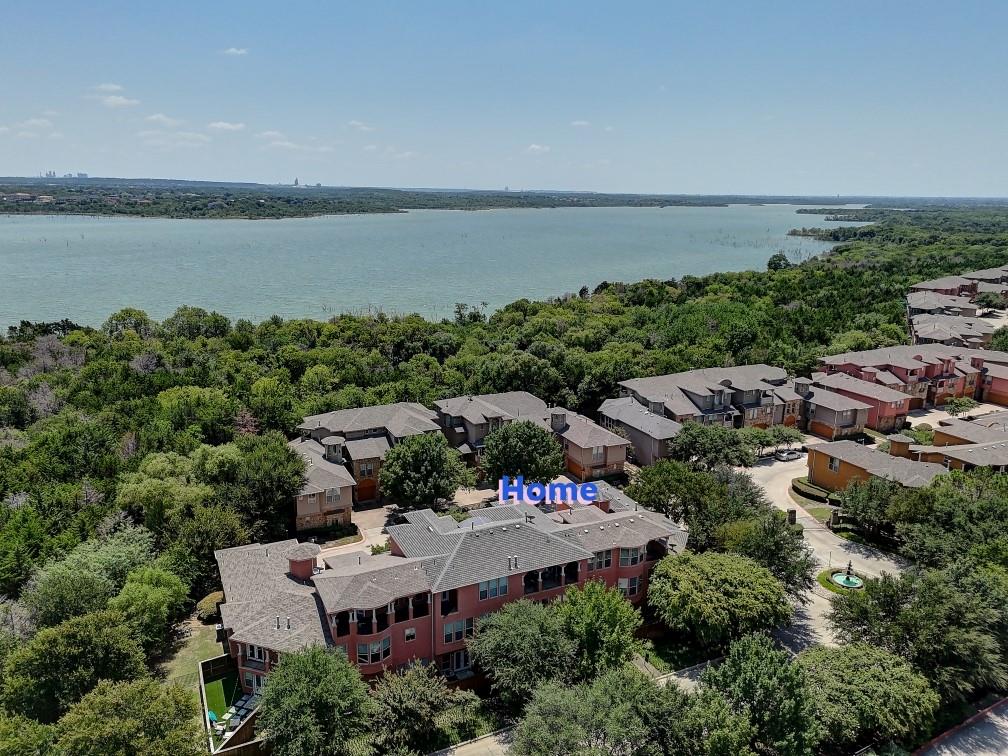 2600 Piazza Court, Unit 5 Grand Prairie, TX 75054 - Photo 3 of 30 an aerial view of a house with a lake view