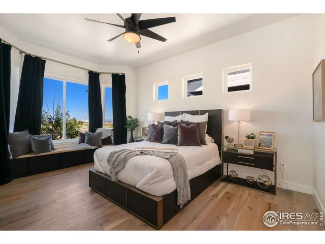 a bedroom with bed and window