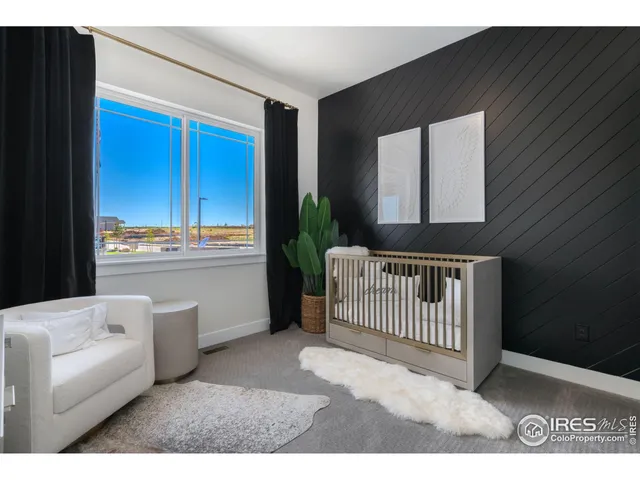 a living room with a couch and a window