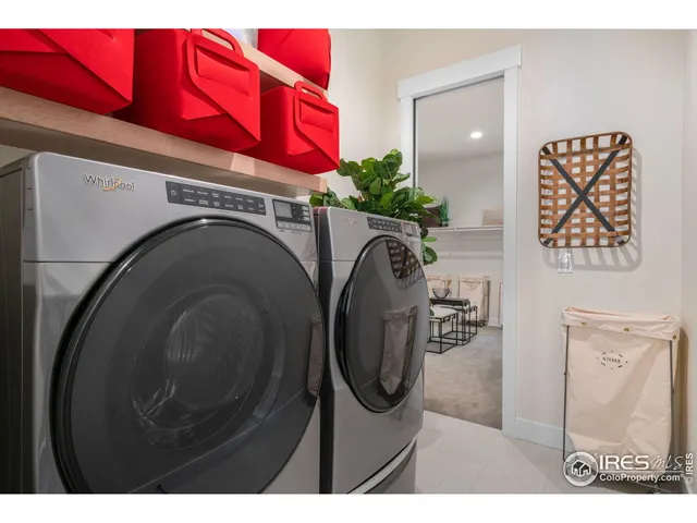 a utility room with closet dryer and washer