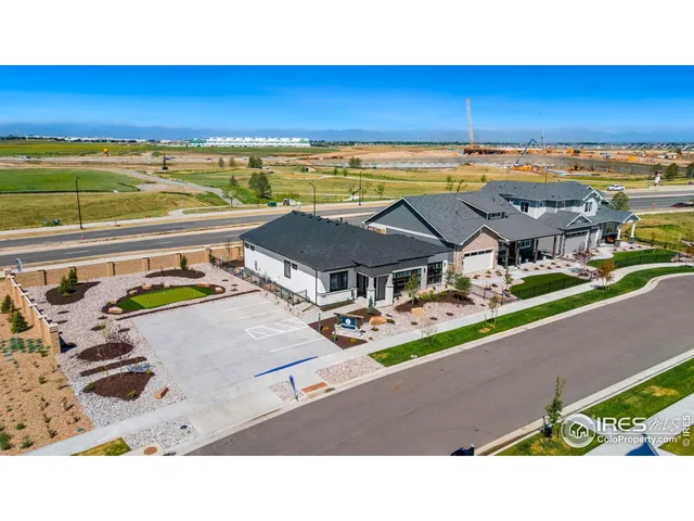 an aerial view of a house with a swimming pool yard and mountain view