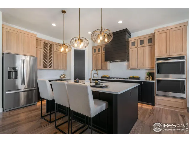 a kitchen with cabinets and stainless steel appliances