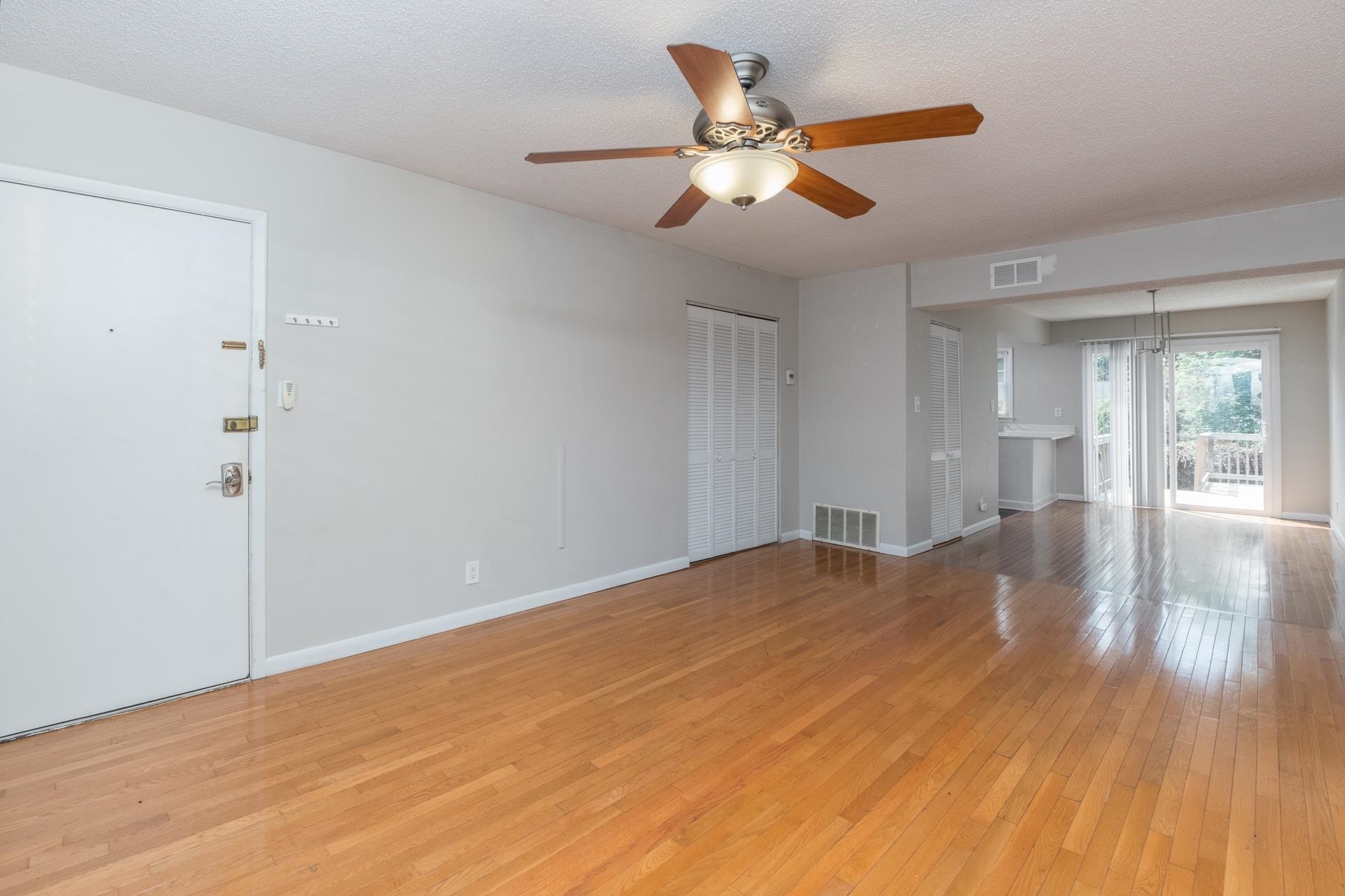 2527 Hydraulic Road, Unit 17 Charlottesville, VA 22901 - Photo 12 of 35 a view of an empty room with wooden floor