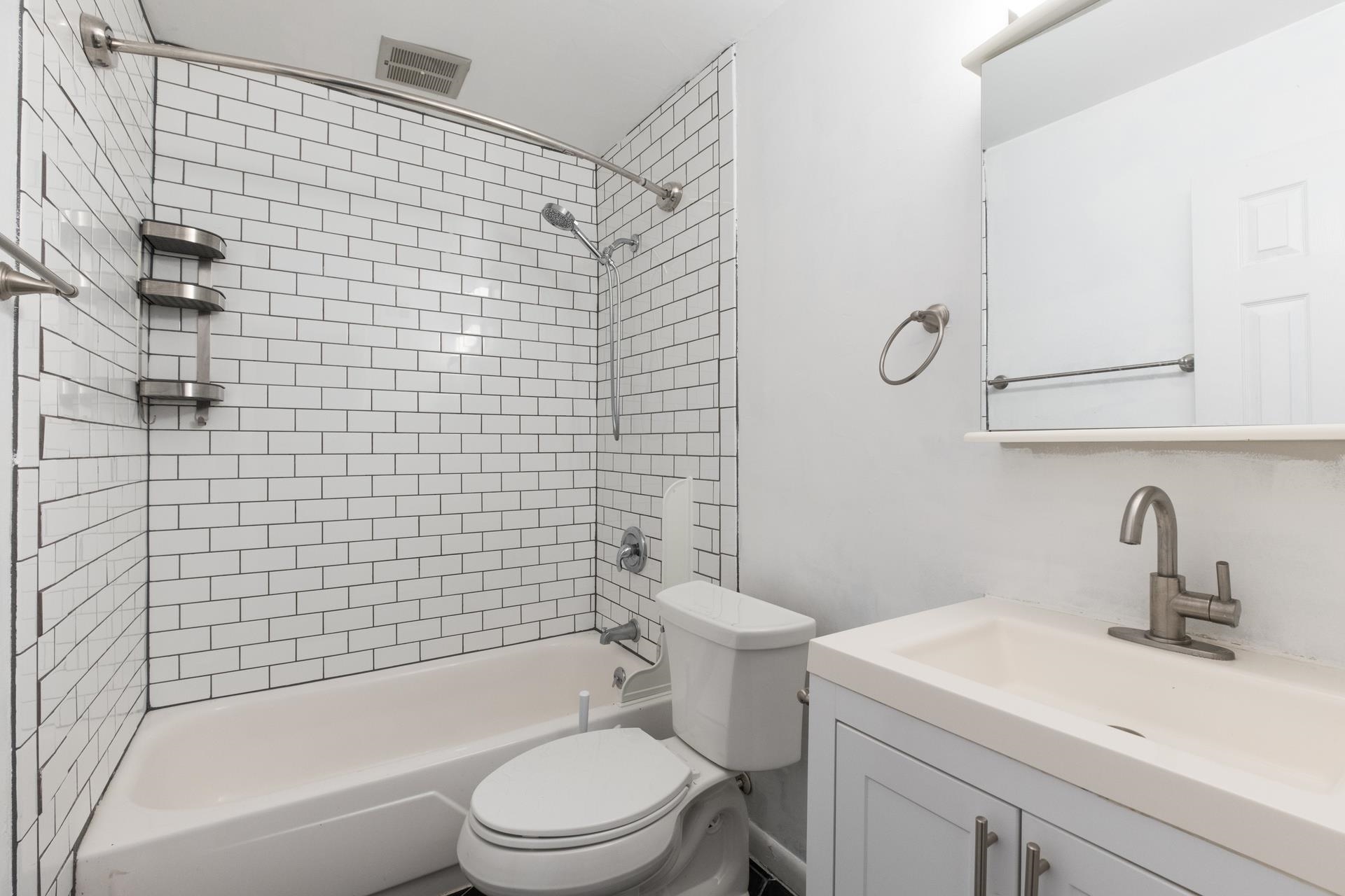 2527 Hydraulic Road, Unit 17 Charlottesville, VA 22901 - Photo 8 of 35 a bathroom with a sink toilet and shower