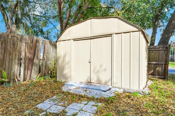 a view of a backyard of the house