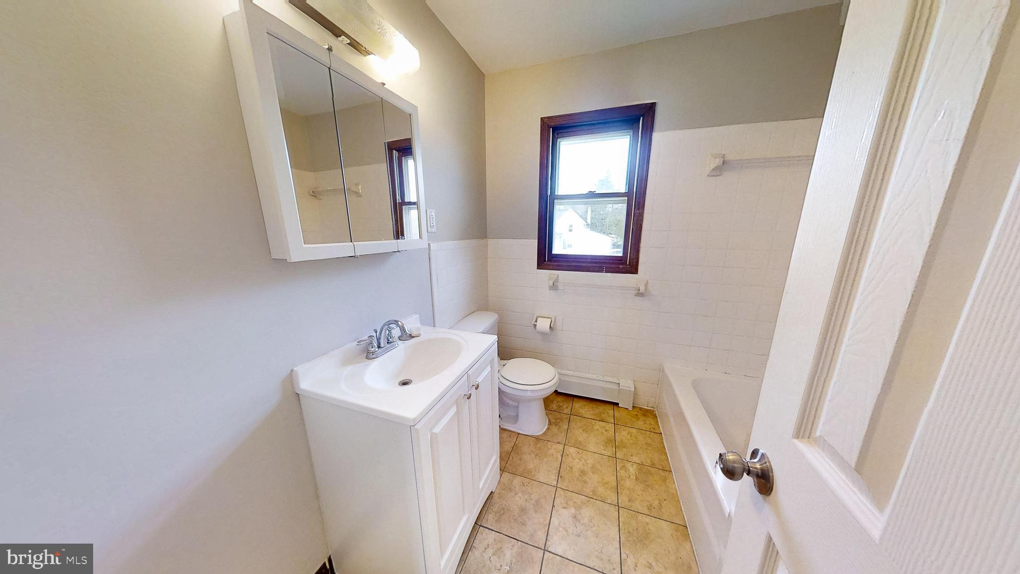 653 Buckshutem Road Bridgeton, NJ 08302 - Photo 18 of 29 a bathroom with a sink and a mirror
