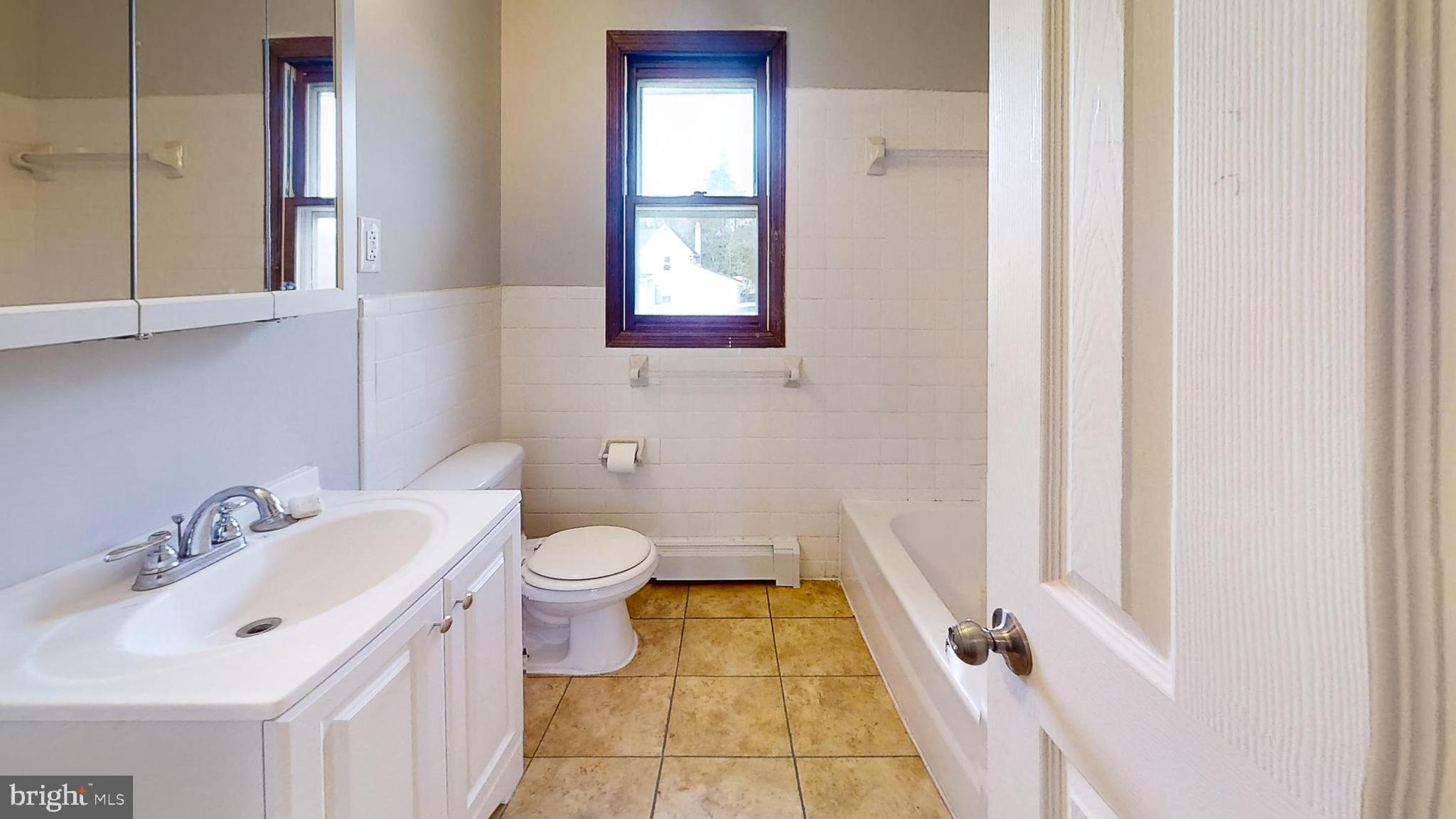 653 Buckshutem Road Bridgeton, NJ 08302 - Photo 19 of 29 a bathroom with a sink and a mirror