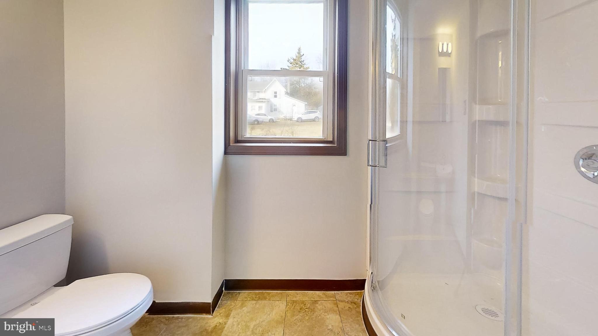 653 Buckshutem Road Bridgeton, NJ 08302 - Photo 25 of 29 a bathroom with a toilet and a shower