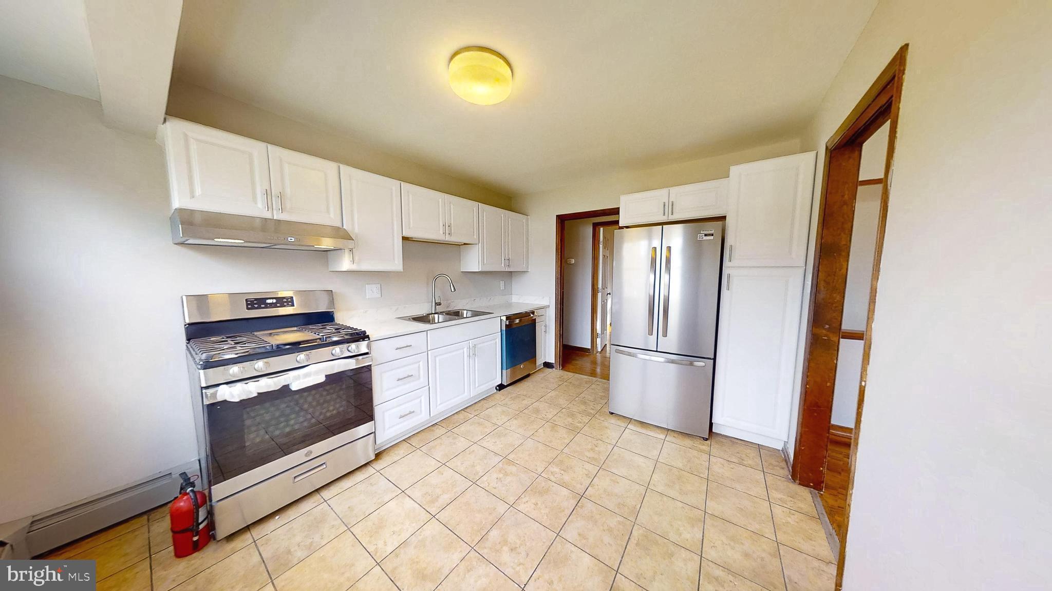 653 Buckshutem Road Bridgeton, NJ 08302 - Photo 10 of 29 a kitchen with stainless steel appliances granite countertop a refrigerator sink and stove