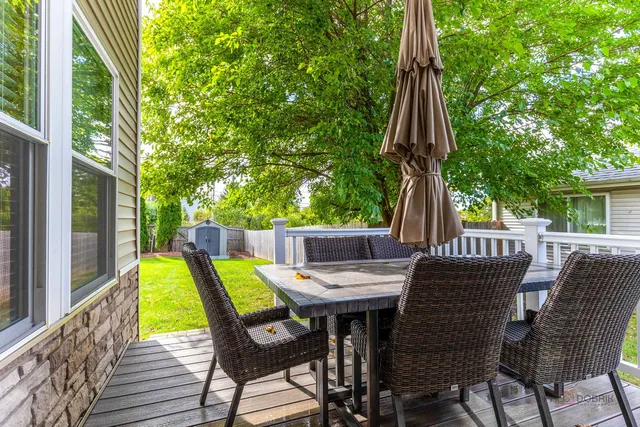 a view of an outdoor sitting area with furniture and backyard