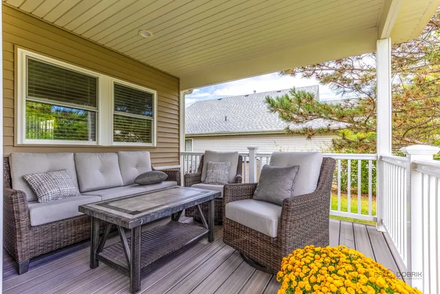 a outdoor living space with furniture and a potted plant