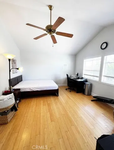 a bedroom with furniture and a window
