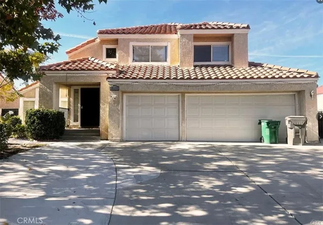 a front view of a house with a garage