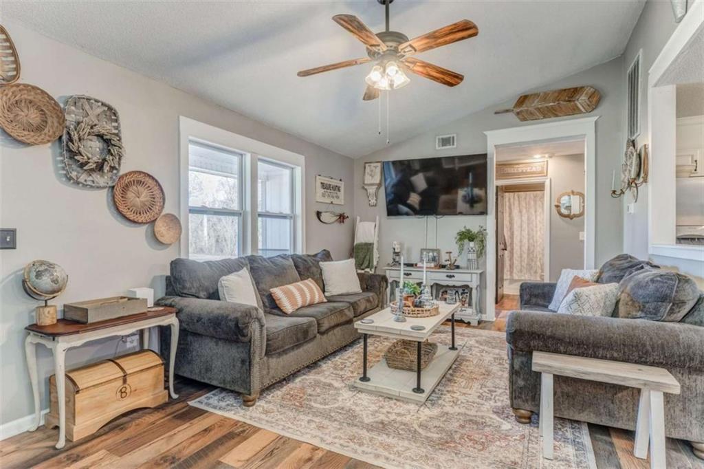 943 Shiloh Road Cedartown, GA 30125 - Photo 11 of 51 a living room with furniture a flat screen tv and a window