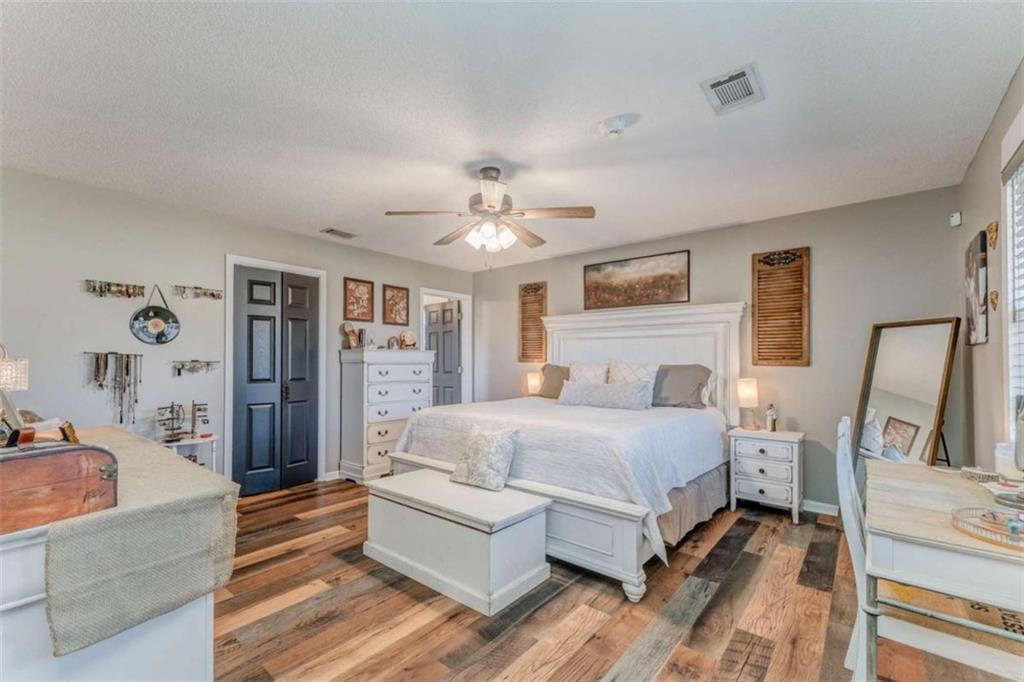 943 Shiloh Road Cedartown, GA 30125 - Photo 21 of 51 a spacious bedroom with a bed couch and window