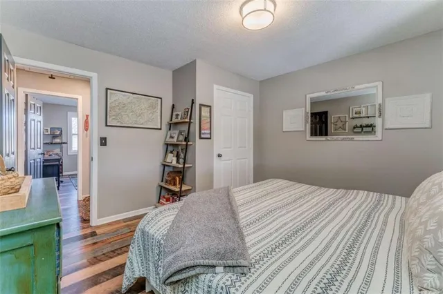 a bedroom with a bed and a closet