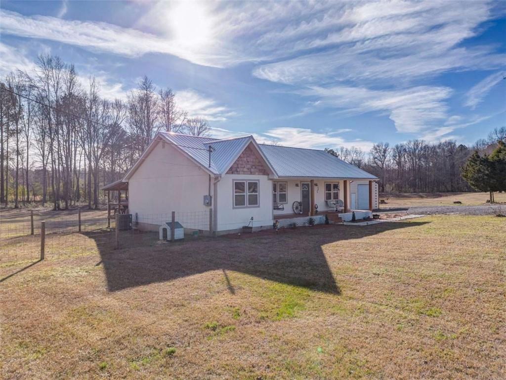 943 Shiloh Road Cedartown, GA 30125 - Photo 4 of 51 a view of a house with yard and covered in snow