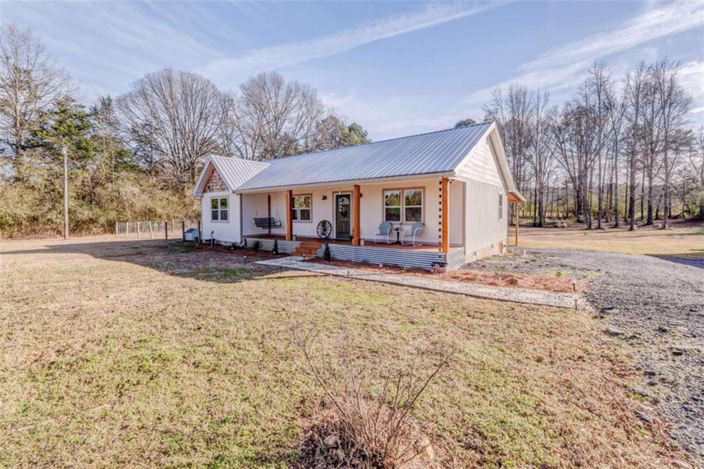 943 Shiloh Road Cedartown, GA 30125 - Photo 43 of 51 a front view of house with yard covered in snow
