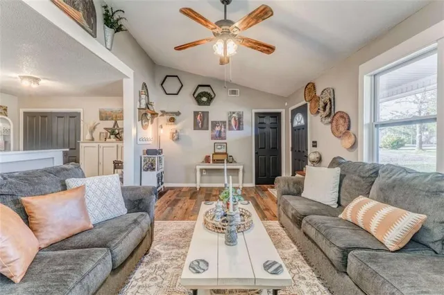 a living room with furniture and a large window