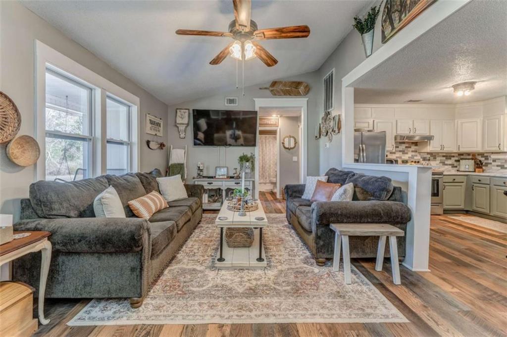 943 Shiloh Road Cedartown, GA 30125 - Photo 10 of 51 a living room with furniture and a fireplace