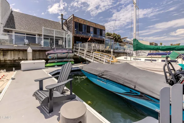 a view of a patio with chairs and a table