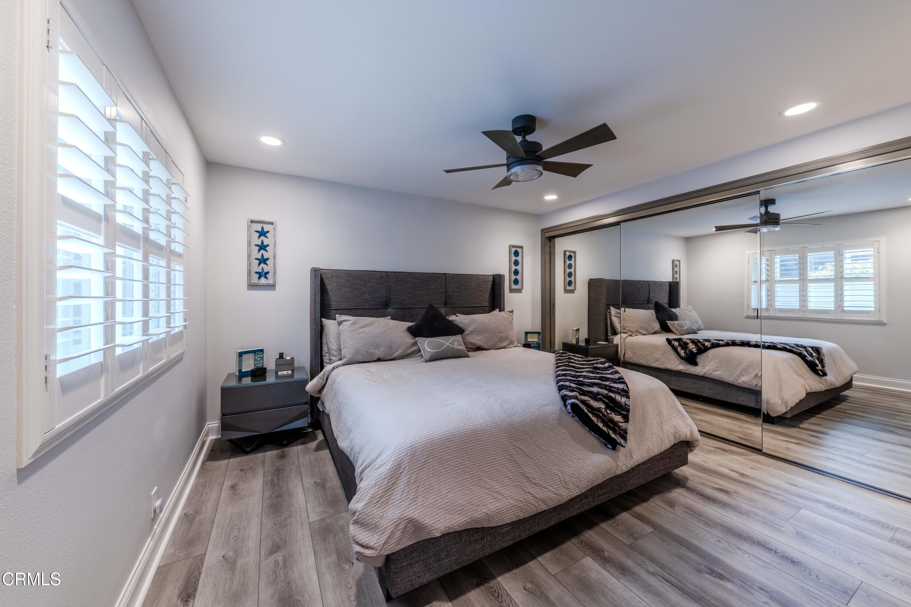 4511 Gateshead Bay Oxnard, CA 93035 - Photo 22 of 36 a bedroom with double bed and a large window