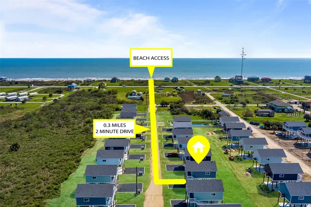 an aerial view of a house with swimming pool outdoor seating and yard