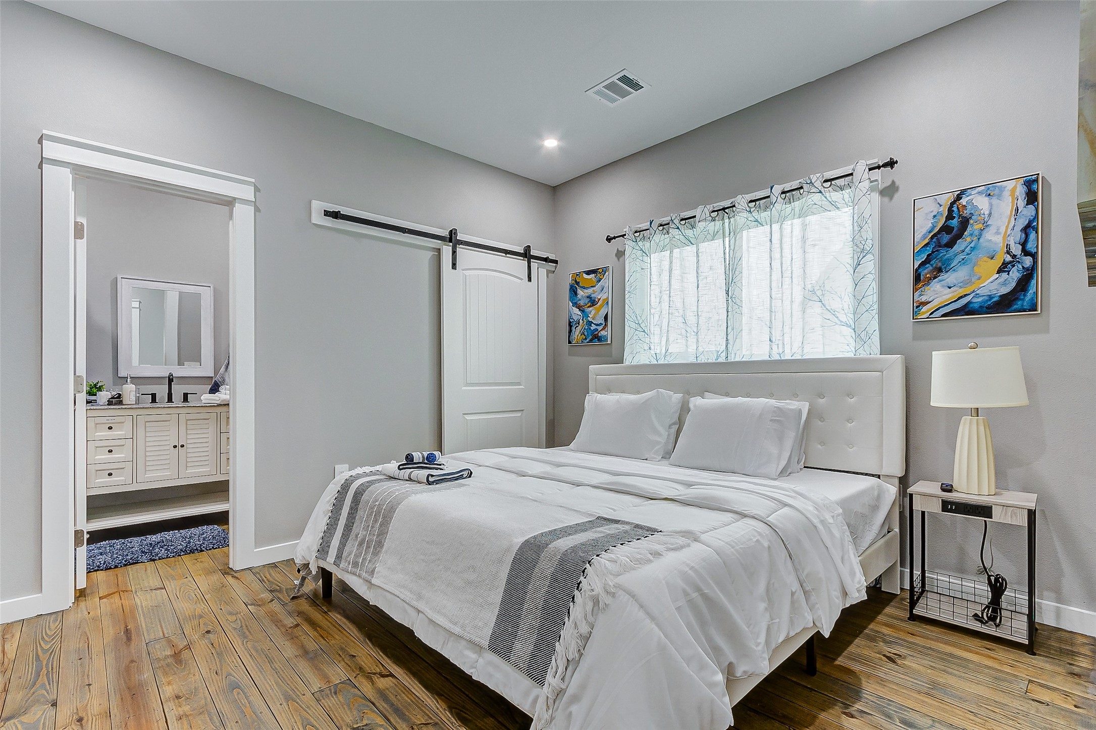 1079 Johnson Road Port Bolivar, TX 77650 - Photo 18 of 35 a bedroom with a bed and a view of bathroom