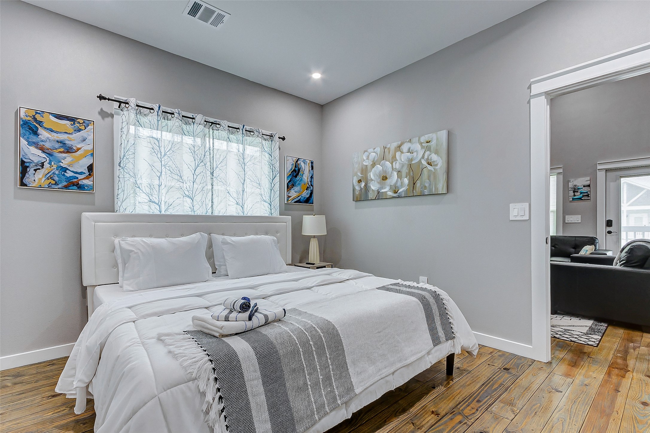 1079 Johnson Road Port Bolivar, TX 77650 - Photo 19 of 35 a bedroom with a bed and a painting on the wall