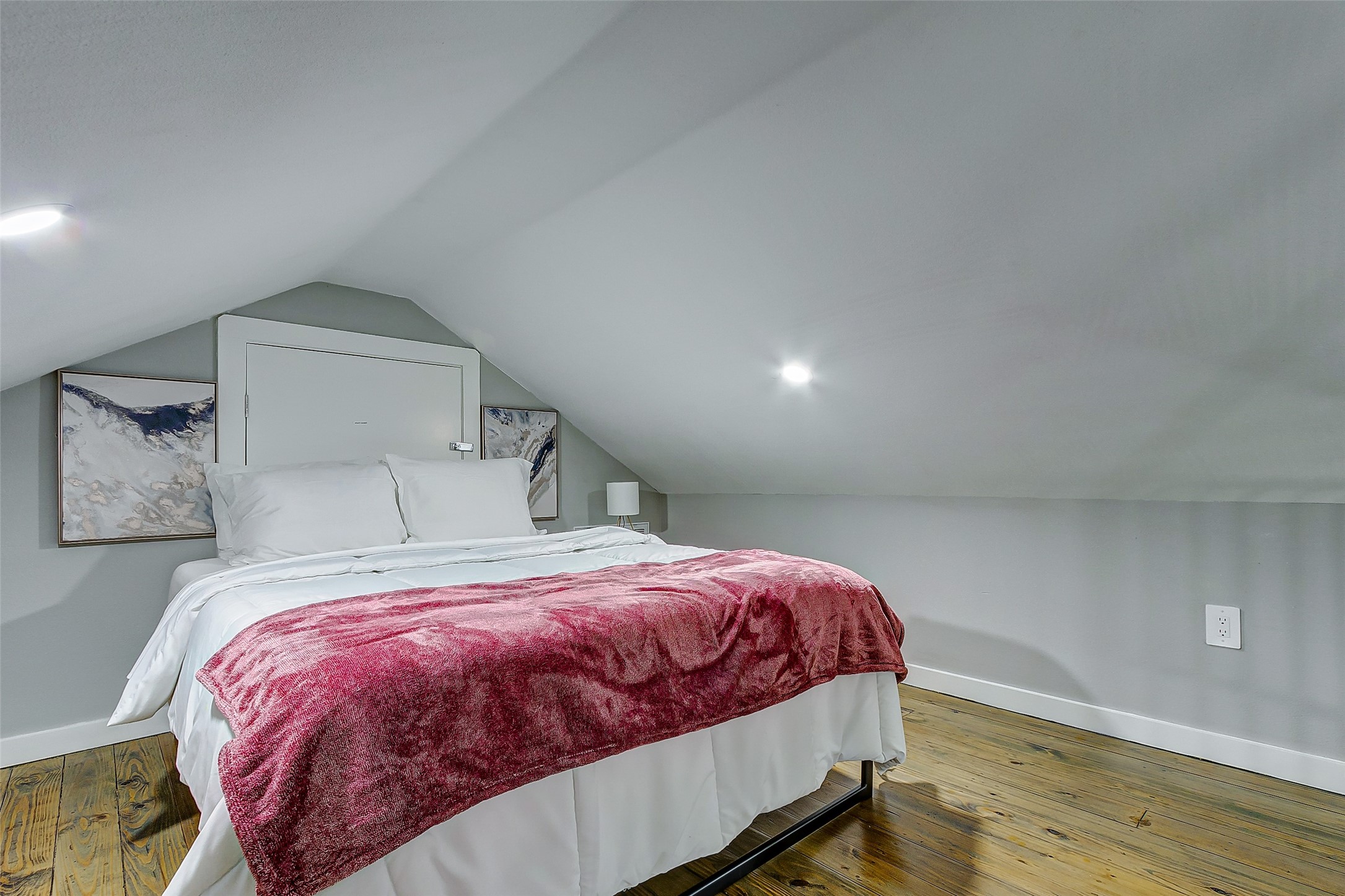 1079 Johnson Road Port Bolivar, TX 77650 - Photo 22 of 35 a bedroom with a bed and wooden floor