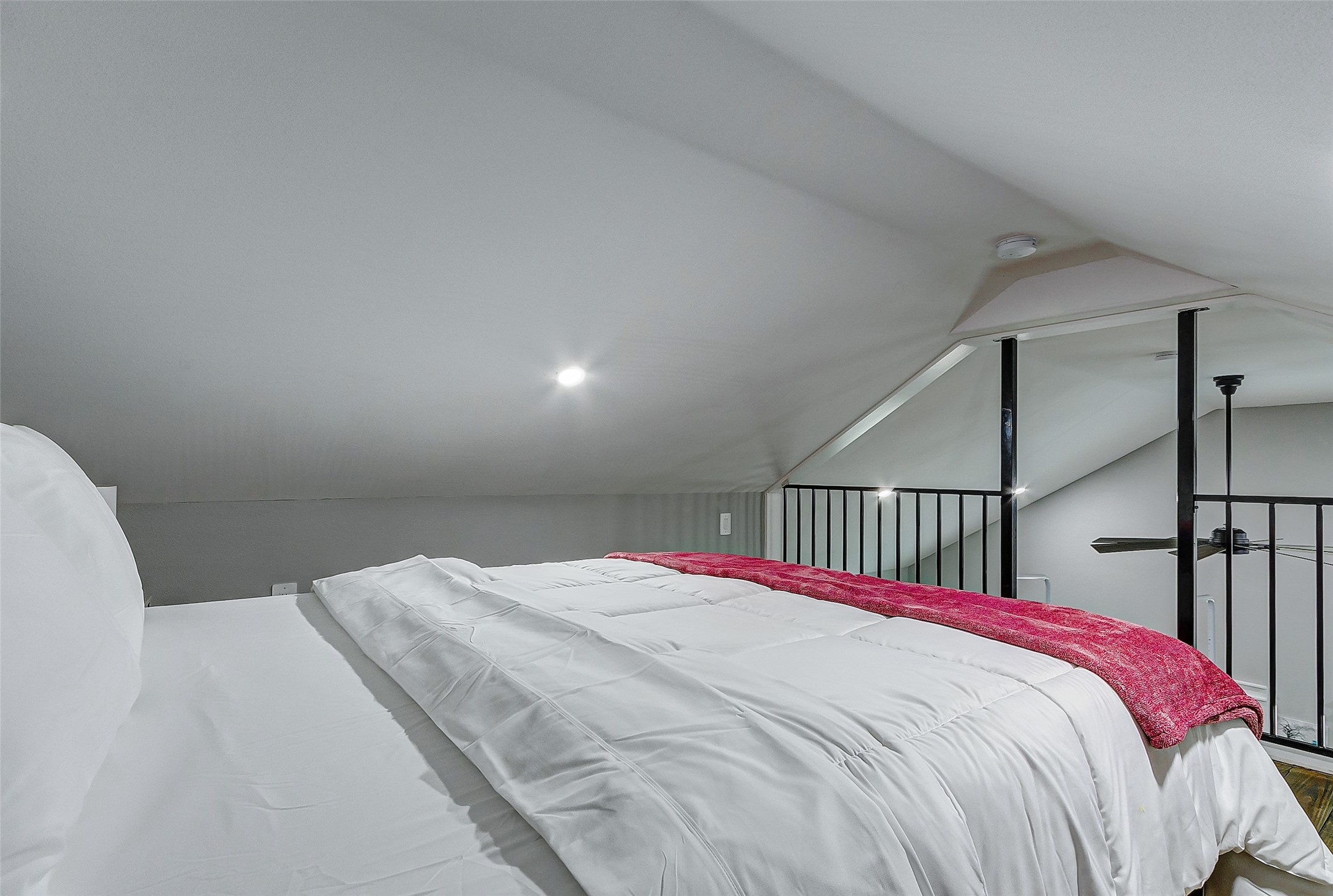 1079 Johnson Road Port Bolivar, TX 77650 - Photo 23 of 35 a bed sitting in a bedroom next to a window