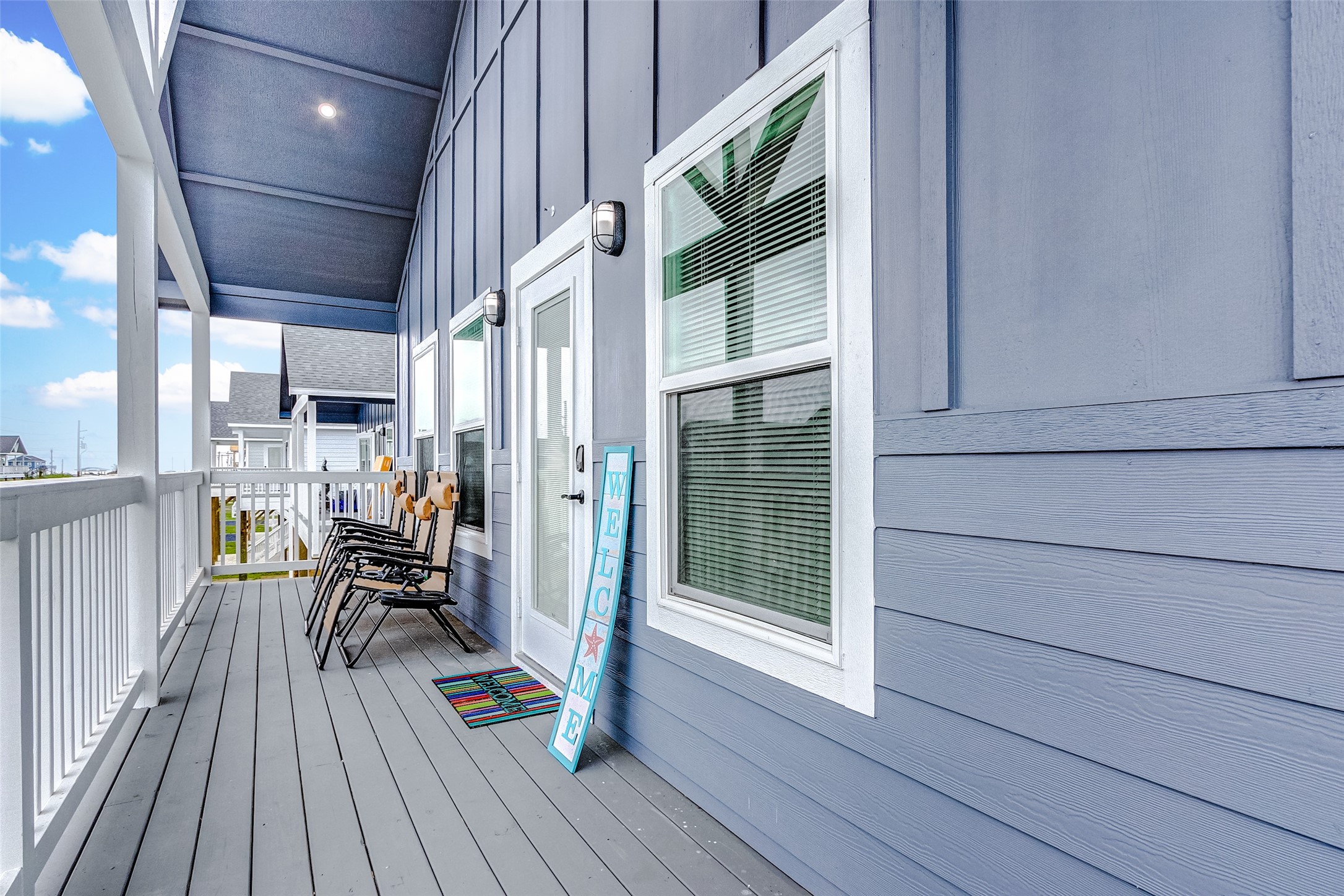 1079 Johnson Road Port Bolivar, TX 77650 - Photo 25 of 35 a view of a house with a chairs and table on the wooden floor