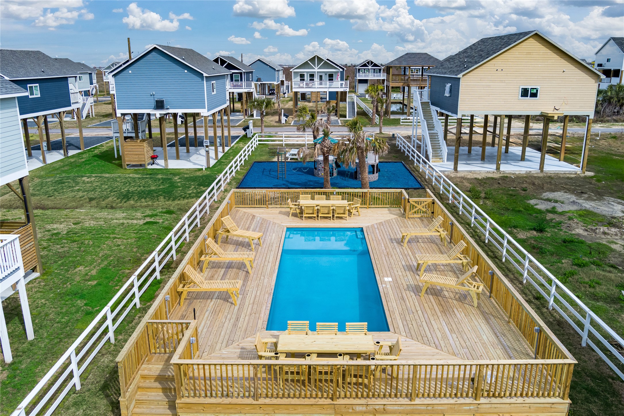 1079 Johnson Road Port Bolivar, TX 77650 - Photo 4 of 35 a view of swimming pool with a garden and deck