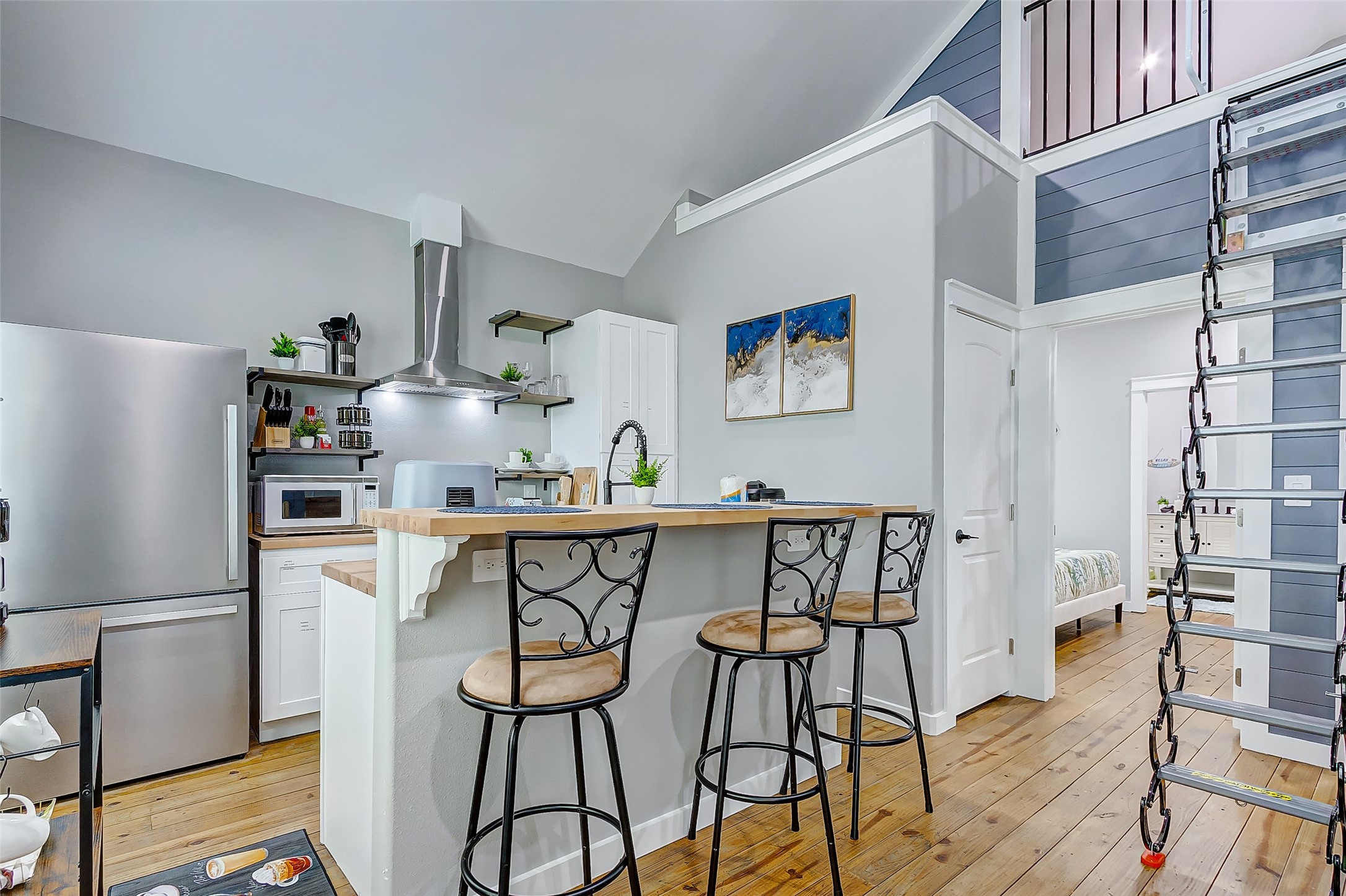 1079 Johnson Road Port Bolivar, TX 77650 - Photo 10 of 35 a kitchen with stainless steel appliances a refrigerator and a table