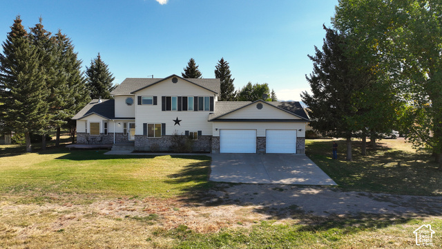 750 South Big Road Soda Springs, ID 83276 - Photo 1 of 40 Two-story residence with a two-car garage, stone and siding exterior, and a concrete driveway