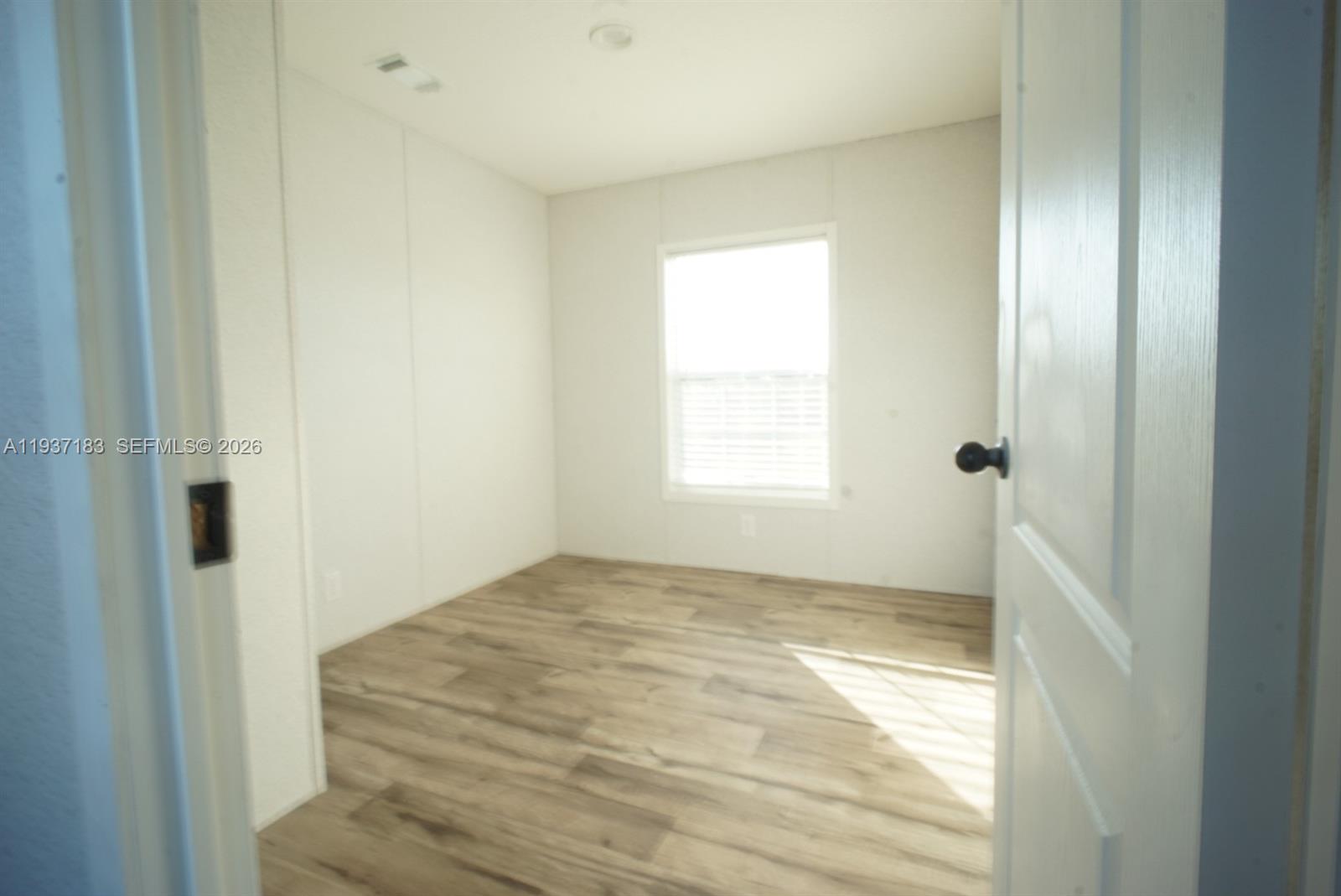 130 North Granja Street Clewiston, FL 33440 - Photo 7 of 10 a view of an empty room and window