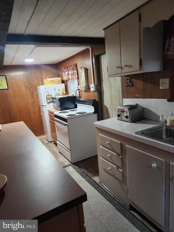 a view of kitchen with car parked