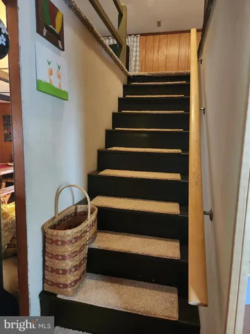 a view of bathroom with a sink and mirror