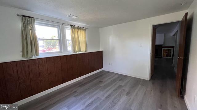 1314 Hillcrest Drive Frederick, MD 21703 - Photo 11 of 11 wooden floor in an empty room with a window