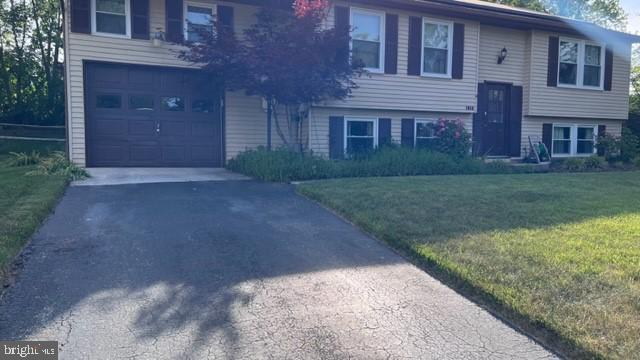 1314 Hillcrest Drive Frederick, MD 21703 - Photo 2 of 11 a view of a brick house with a yard