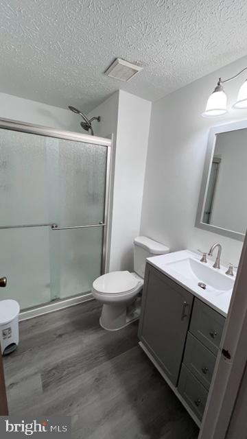 1314 Hillcrest Drive Frederick, MD 21703 - Photo 7 of 11 a white toilet sitting next to a bathroom sink